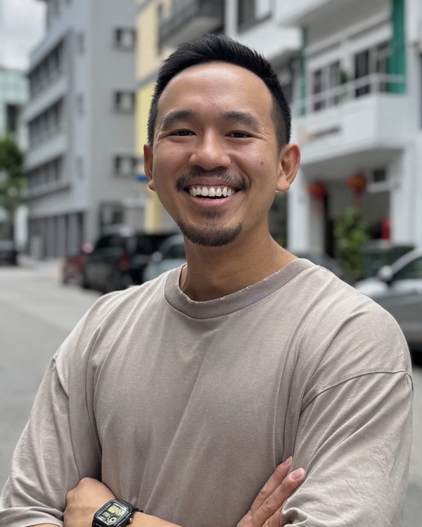 Mark, Head of Product, smiling with arms folded